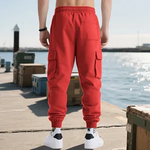 Back view of men's red heavy cargo sweatpants with side pockets and ribbed cuffs.