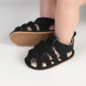 Detail view of breathable black braided baby boy sandals for infants aged 0-12 months