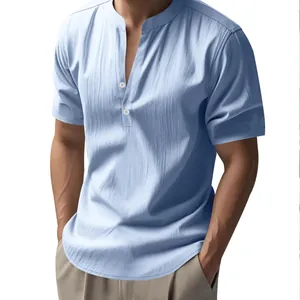 Light blue men's linen short sleeve shirt with stand collar and button detail.