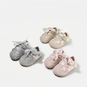 Stylish soft sole baby girl walking shoes in pink, beige, and grey with flower accents