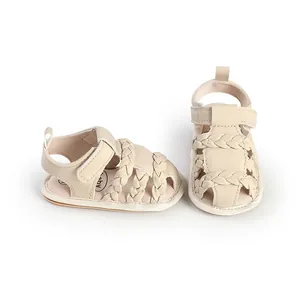 Macro view of breathable beige baby sandals featuring stylish braided straps design