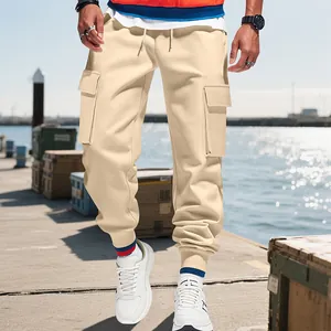 Detailed view of men's heavy American style cargo joggers in beige with utility pockets