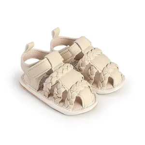 Detail showing the intricate braided design and soft cream texture of baby pre-walker sandals