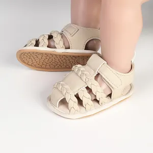 Braided beige baby sandals detail showing textured non-slip sole and breathable design
