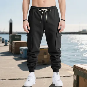 Close-up of men's heavyweight black cargo sweatpants with multi-pockets and drawstring.