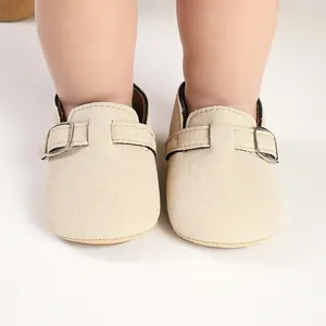 Infant retro beige suede loafers featuring an adjustable metal buckle strap detail
