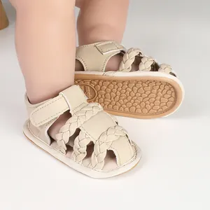 Detailed view of beige braided baby sandals with non-slip soft rubber sole