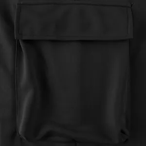 Close-up view of the functional flap pocket detail on heavy-duty black cargo pants.