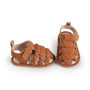 Detailed view of brown braided baby sandals with soft sole and convenient velcro closure