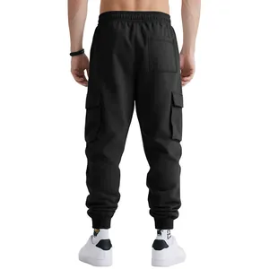 Back view of men's heavy black cargo jogger pants with multiple pockets and elastic cuffs