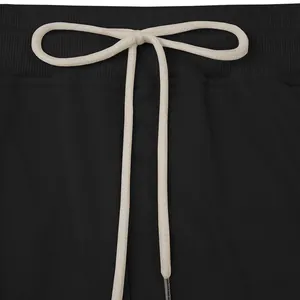 Close-up of heavyweight black sweatpants with adjustable white drawstring waist