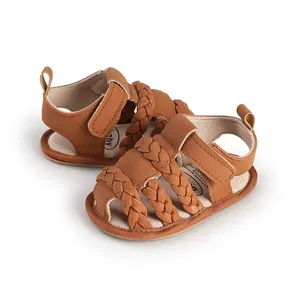 Close-up of brown braided baby sandals with soft breathable soles for infants
