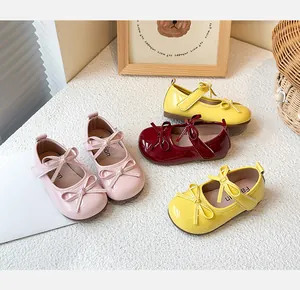 Kids bow patent leather Mary Janes in pink, yellow and burgundy options.