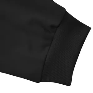 Detailed close-up of the ribbed cuff on heavy black men's casual high street sports pants