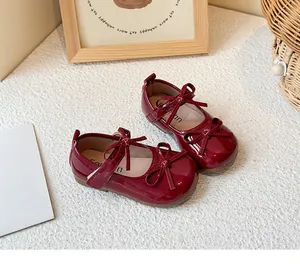 Shiny dark red girls' Mary Jane princess shoes with elegant double bow details and flat soles