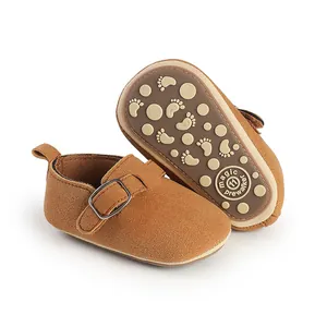 Close-up detail of the anti-slip sole and brown suede texture on retro baby prewalker shoes