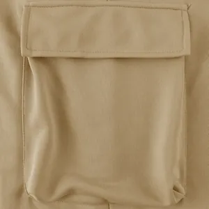 Close-up detail of a cargo pocket on khaki heavyweight men's casual trousers.