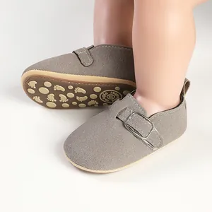 Detail showing baby mocha suede Birkenstock style shoes with non-slip rubber sole