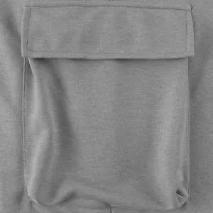Macro view of the functional cargo pocket on grey heavyweight knit casual pants