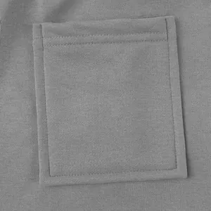 Close-up detail of a functional patch pocket on grey heavyweight men's cargo sweatpants.