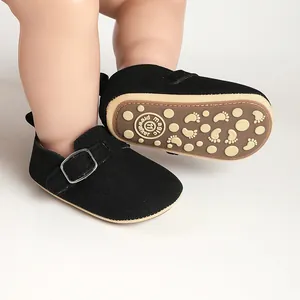 Vintage black buckled baby pre-walker shoes featuring a soft anti-slip footprint sole