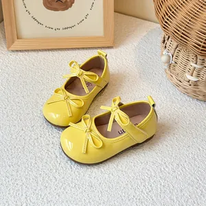 Bright yellow children's Mary Jane shoes with cute bow-knot and soft flexible soles