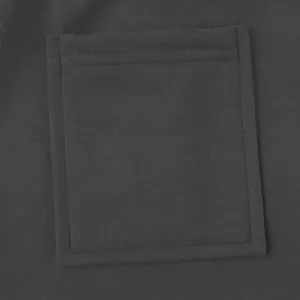 Close-up of a square patch pocket and heavyweight charcoal fabric on men's cargo pants