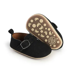 Black matte retro baby prewalker shoes with patterned anti-slip rubber sole detail view
