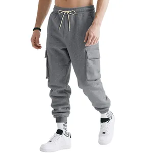 Detailed close-up of men's gray heavy-duty cargo sweatpants featuring large side pockets