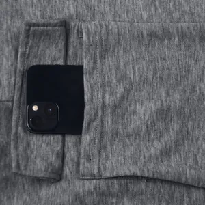 Detailed view of the large side pocket on heavy weight gray men's joggers