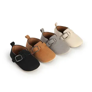 Retro frosted flat baby shoes in four colors with buckle straps on white background.