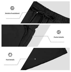 Dettagli macro di pantaloncini di lino neri che mostrano vita, tasca laterale e orlo.