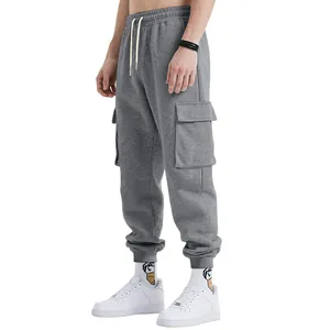 Detail view of men's heavy grey cargo sweatpants featuring large side utility pockets