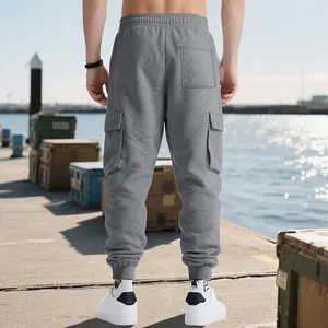 Back view of men's grey heavy cotton cargo sweatpants with multiple utility pockets