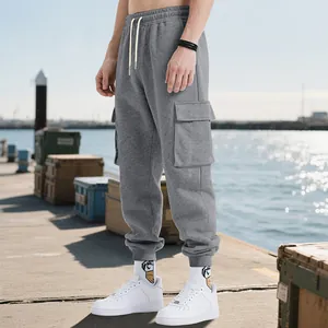 Full view of grey cargo sweatpants showing relaxed fit and large side utility pockets