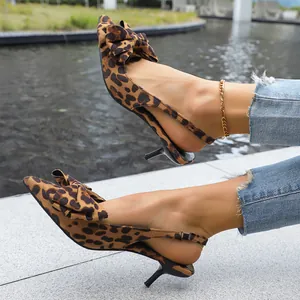 Elegant pointed toe leopard print slingback kitten heels with decorative bow details