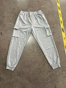 Flat lay view of gray men's heavy weight oversized cargo sweatpants with multi-pockets
