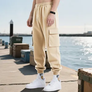 Close-up of heavyweight khaki men's cargo joggers featuring side flap pocket and ribbed cuffs.