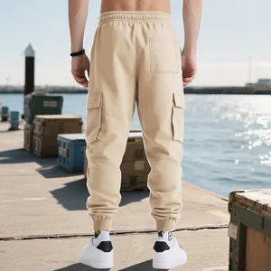 Rear view of men's heavyweight beige cargo sweatpants with pockets and tapered cuffs