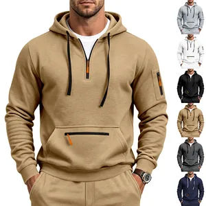 Detail view of a heavyweight fleece hoodie with utility sleeve pockets and half-zip front