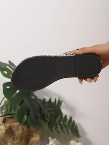 Detailed view of the anti-slip black rubber sole on Bohemian style printed flat sandal
