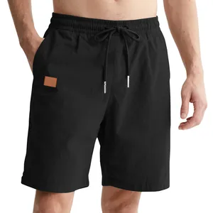 Close-up of men's loose casual beach shorts featuring drawstring waist and metal tips.