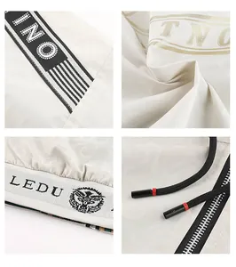 Detailed close-up views of white men's hooded jacket featuring printed stripes and zipper