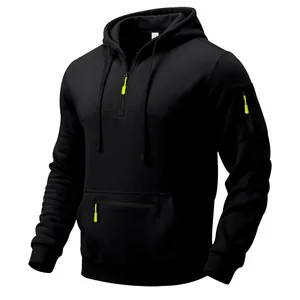 Detail view of a black men's hoodie with vibrant lime green zipper accents.