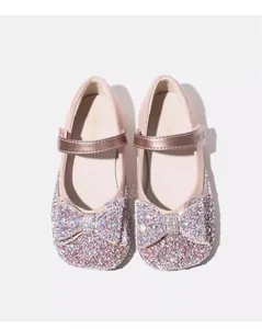 Top view of pink girls' glitter princess shoes with a large sparkling bow detail