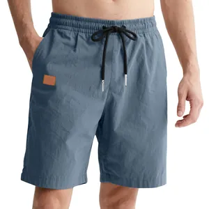 Detailed view of men's casual blue shorts with elastic waist and drawstring