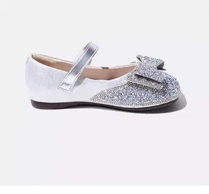 Detailed side view of silver glitter girls Mary Jane flats with a rhinestone bow