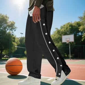 Pantalones de baloncesto negros para hombre con botones laterales en cancha