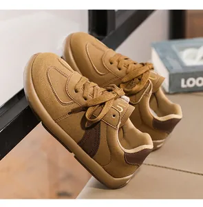 Detailed view of brown retro German Army Trainer sneakers featuring a stylish lace-up design