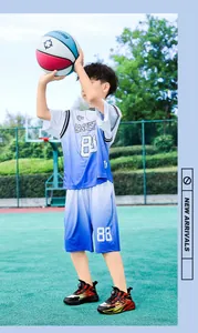 Detailed shot of boys trend basketball sneakers with non-slip soles and dial closure.